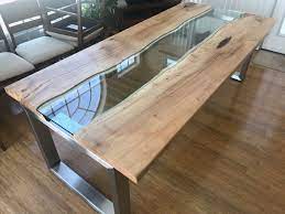 Wood comes in so many different colors, shapes, and configurations, there's no limit to the variety of ways it can be used. Custom Made River Glass Dining Table By Villella Custom Woodworking Custommade Com