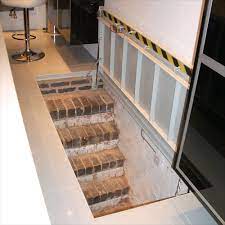 The first rule of thumb is no dirt basements. Cellar Access Staircase Door