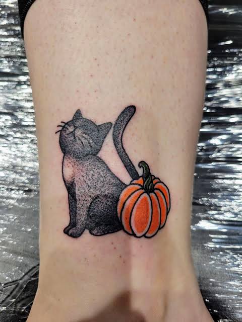 Got this tattoo on my birthday of my real life Halloween kitty and it glows under black light! : r/halloween