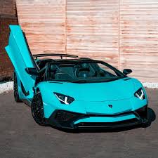 The car features an entirely new design and does away with the conventional doors, now incorporating butterfly doors instead. Lamborghini With The Butterfly Doors Sweet My Fave Teal Color Dream Cars Lamborghini Sports Cars Luxury Lamborghini Aventador