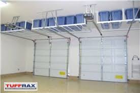 Another Example Of Hanging Storage Over The Garage Doors Garage Overhead Storage Solutions Google Search Garage Organization Garage Decor Garage Storage