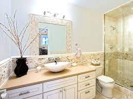 Notice how the chandelier is hanging smack in the middle of the window, providing wonderful curvy contrast to the rectangular shape behind it. Beige Bathroom Ideas Beige And White Bathroom Tile Ideas Beige Bathroom Beige Tile Bathroom Bathroom Beige Tile