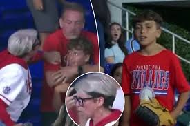 Phillies fan slammed for taking home run ball from young boy after she  chased down dad