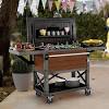 The bar cart is a bit wider than ben's grill cart and has a cooler compartment made to fit a standard 30 quart foam cooler (about $3 at the home depot). 1