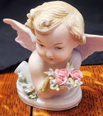 Angel Holding Flower