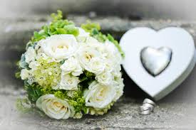 Christie $925 —> order it here. White Bridal Bouquet And Wedding Rings On Stone Stockphoto