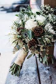 Small details, like watercolor garland with pops of red berries, or more obvious patterns, like plaid paper designs, are wonderful ways to announce your christmas wedding theme to guests. 20 Chic Wedding Bouquets Ideas For Winter Brides Elegantweddinginvites Com Blog Winter Wedding Flowers Christmas Wedding Bouquets Winter Wedding Bouquet