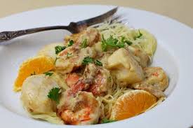 Shrimp And Scallops With Orange Cream Sauce Over Fettuccini Recipe Scallop Recipes Pasta Cream Sauce Pasta Recipes