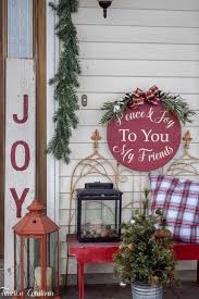 Take your outdoor evergreen decor to the next level by adding dozens of red ribbons and cranberries. Decorating Your Outdoor Space For The Holidays Deck The Home Blog Hop Timeless Creations