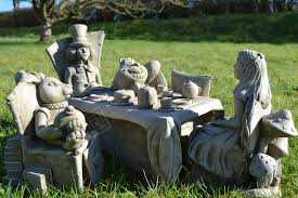 Alice's adventures in wonderland here is our captivating mad hatter's tea. Alice In Wonderland Tea Party Stone Garden Statue Etsy