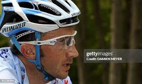 Danish cyclist Knud Enemark Jensen is attended by a Danish official... News  Photo
