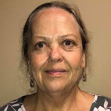 Why are my iris flowers not blooming? Every yard in the hood has blooms.  Suggestions? I thought sun but some are in shade. Picture stolen from my  neighbor's yard.🤣