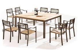 It features a large, square table and eight matching chairs. Hyacinth Modern Outdoor Dining Set For 8