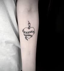 Minimalist Style Tattoo Of A Snake Wrapped Around A Heart And Inked On The Left Forearm Snake Tattoo Designs Snake Tattoo Tattoos