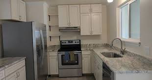 Caspian Cabinets From Lowe S Sherwin Williams Steamed Milk Paint Color Glacier Sands Marble Counterto Kitchen Renovation Kitchen Remodel Kitchen Cabinet Colors