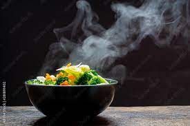 Thank you to beef.it's what's for dinner. The Steam From The Vegetables Carrot Broccoli Cauliflower In A Black Bowl A Steaming Boiled Hot Healthy Food On Table On Black Background Hot Food And Healthy Meal Concept Stock Photo