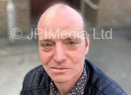 39381595-Colin Barber holding a poster about a charity evening he is  organising. Picture by FRANK REID.
