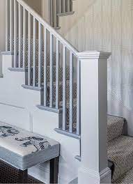 Light Gray Staircase Handrail And Spindles Add A Finishing Touch On Stairs Fitted With A White And Gray Her Staircase Handrail Staircase Design White Staircase