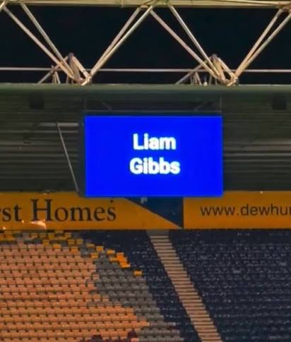 Preston North End. Rock bottom of the Championship after four games. Yet to  bag a single point. And they're announcing the signings of two players.  Ont' big screen. Whilst 3-1 down to