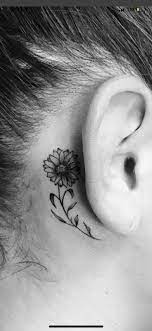 Tattoo Ideas Small Fine Line Sunflower Behind The Ear Tattoo Black And Gray Black Sunflower Tattoo Behind Ear Behind Ear Tattoos Sunflower Behind Ear Tattoo