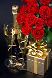 red roses, golden gift and and champagne | Stock image | Colourbox