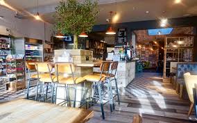 The kind of place you can show up in shorts/sweats before or after your weekend chores and feel at home. Windowbox Cafe Commercial Interior Design Sacha Interiors