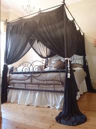 White pictures in frames are hanging on the wall too. Diy Gothic Canopy Bed Novocom Top