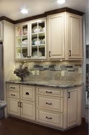 Kitchen With White Distressed Finish And Dark Glaze Accent Distressed Kitchen Cabinets Glazed Kitchen Cabinets Kitchen Remodel