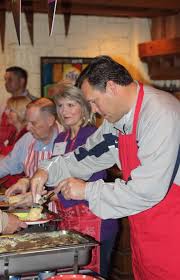Celebrity servers enjoy helping at breakfast