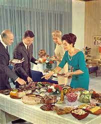 Preparing the table for a formal dinner party. 22 1960s Dinner Party Ideas Dinner Party Party Mad Men Party