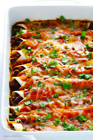 It has layers of red enchilada sauce, seasoned ground beef, corn tortillas, and cheese. Beef Enchiladas Gimme Some Oven