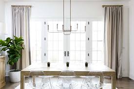 For a long rectangle table, i like the linear chandelier cover about 2/3 length and 1/3 width to let everybody sitting around table feel bright. 27 Dining Room Lighting Ideas For Every Style