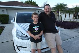 9-year-old's fascination with YouTube videos wins the family a new Tesla