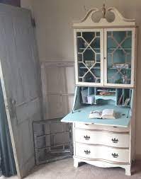In the dining room, a secretary desk with a glass hutch is a lovely way free up space in your kitchen and display special occasion items. Pin On Furniture