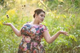 Plus Size Fashion Model In Floral Dress Outdoors, Beautiful Fat Woman With Big  Breasts In Nature, Body Positive Concept Stock Photo, Picture and Royalty  Free Image. Image 154388376.