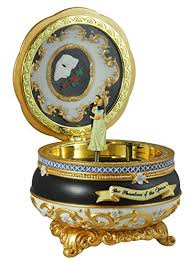 He sees the phantom's music box featuring a toy monkey Phantom Of The Opera Figurines And Music Boxes
