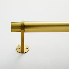 A refrigerator that is beautifully designed, with a modern dispenser, polished door, and sleek handles. Simple Metal Curtain Rod Antique Brass