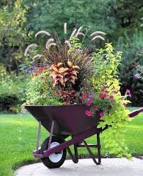 16 Excellent And Awesome Repurposed Garden Decor That Can Live The Garden Atmosp Diy Garden Decor Fall Container Gardens Garden Containers Container Gardening Flowers