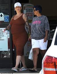Amber is the perfect example to show you can be gorgeous, feminine, and still own having short hair. Amber Rose Shops For Hair Extensions With Her Mom After Cancelling Slutwalk Daily Mail Online