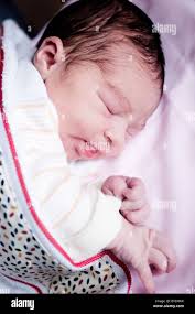 Sleeping Baby in a hospital crib Stock Photo