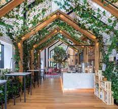 Boutique Coffee Roaster Coperaco S First Cafe Holds A Modern Tree House Modern Tree House Cafe Interior Design Coffee Shops Interior