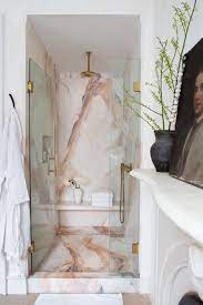 5 Minute Decorating Five Ways To Style Your Bathroom For Summer Guests French Bathroom In 2020 Marble Showers Bathroom Design Trending Decor