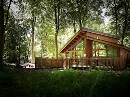 Unspoilt lake views, log fires and rowing boats await your log cabin welcome to a beautiful part of the world. Luxury Hot Tub Lodge Snowdonia National Park Wales Golden Oak Lodge