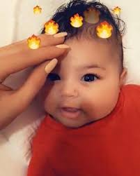 Stormi and Kylie hand