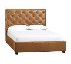 Some king sized bed heads may wedge between the frame and the wall without needing to be attached in place, which makes it simple. Lorraine Tufted Leather Low Bed Pottery Barn