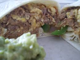 Shredded beef (cooked with bell pepper, onion, and tomato) with eggs, lettuce, guacamole, and salsa mexicana. Froggie S Machaca Burrito From The Lilypad