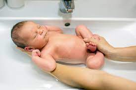 It is not necessary to bathe every day if you change their diaper often and you refresh them with wet towels. Newborn Child Boy Having His Bath In Mothers Stock Photo Picture And Royalty Free Image Image 92368863