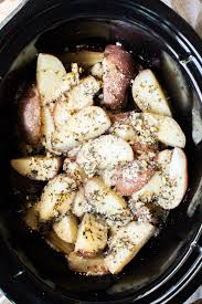 Making mashed potatoes using a slow cooker. Slow Cooker Garlic Parmesan Potatoes The Magical Slow Cooker