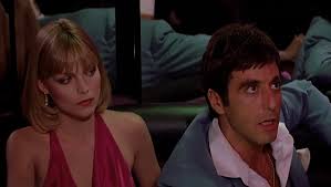 Her white scalloped wedding dress worn during the 'money montage' is 80's poofy, though surprisingly restrained. Michelle Pfeiffer S Halston Style Costumes In Scarface