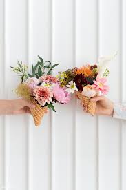 Hold bunch flowers upside down : Download Premium Image Of Two Women Holding Up Flowers In Ice Cream Cones Ice Cream Flower Flower Background Design Floral Photography